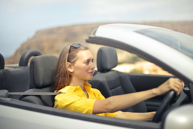 student driving a car