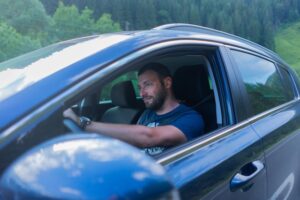 drowsy man driving a car