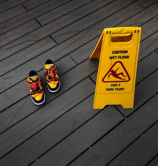 wet floor sign and shoes