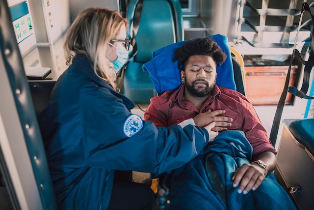 injured man loaded into ambulance