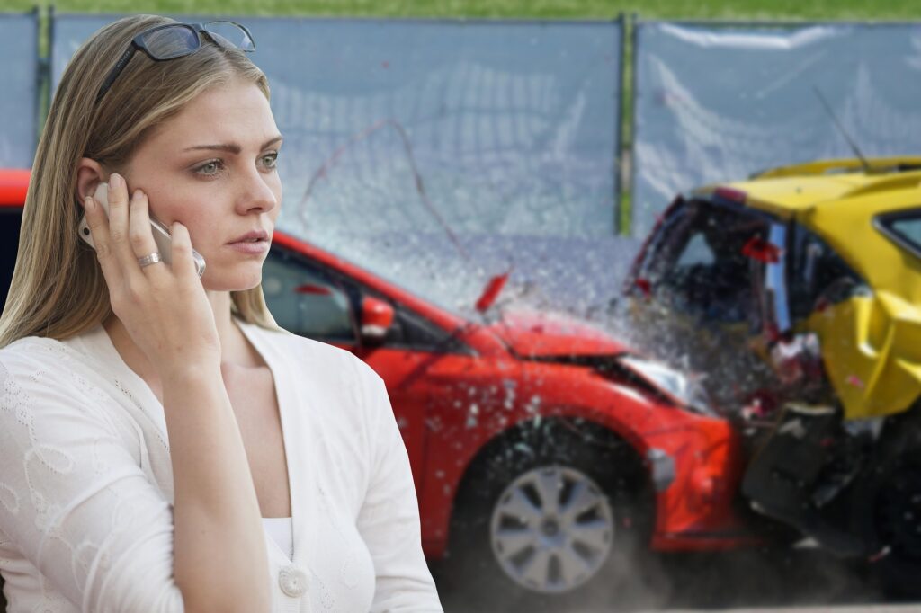 woman on phone in front of rear-end accident